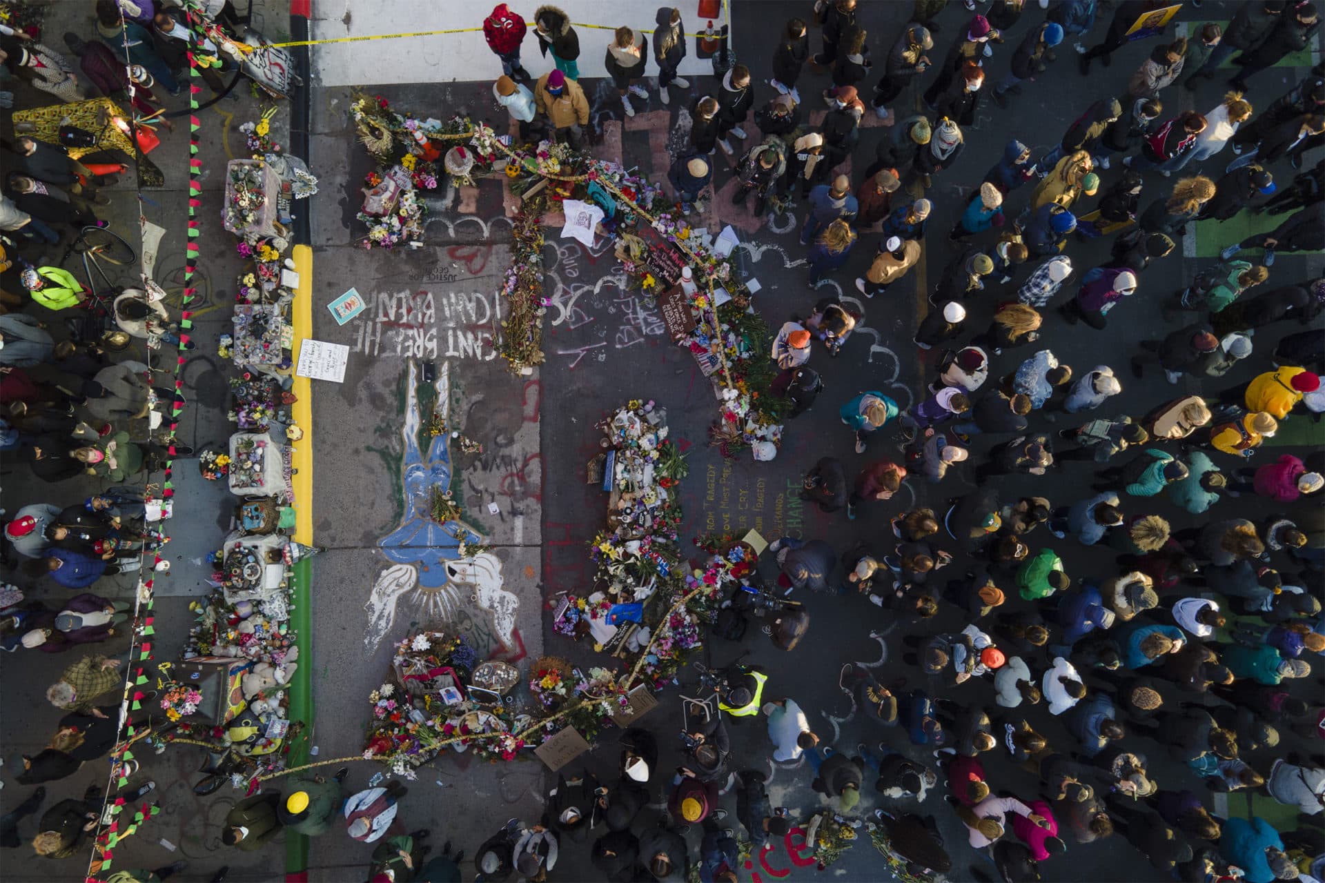 A crowd gathers next to the spot where George Floyd was murdered at George Floyd Square. (Julio Cortez/AP)
