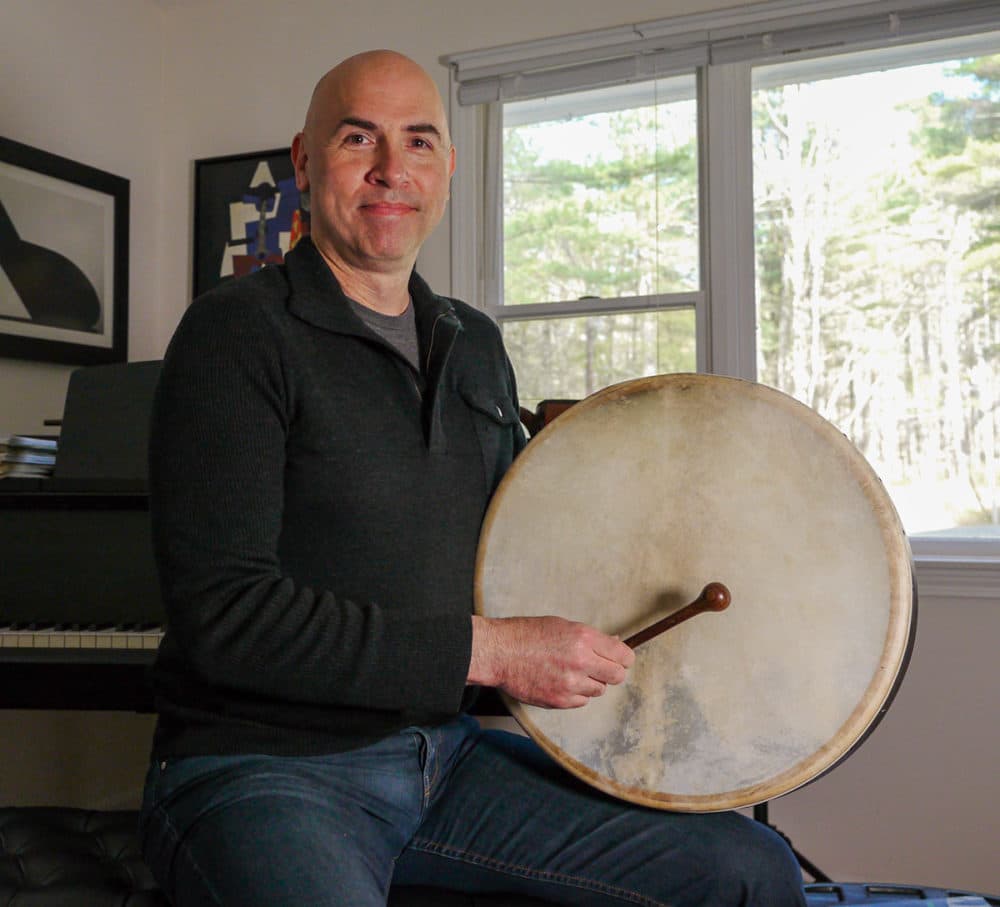 Eric Shimelonis playing the bodhrán. (Photo courtesy of Rebecca Sheir)