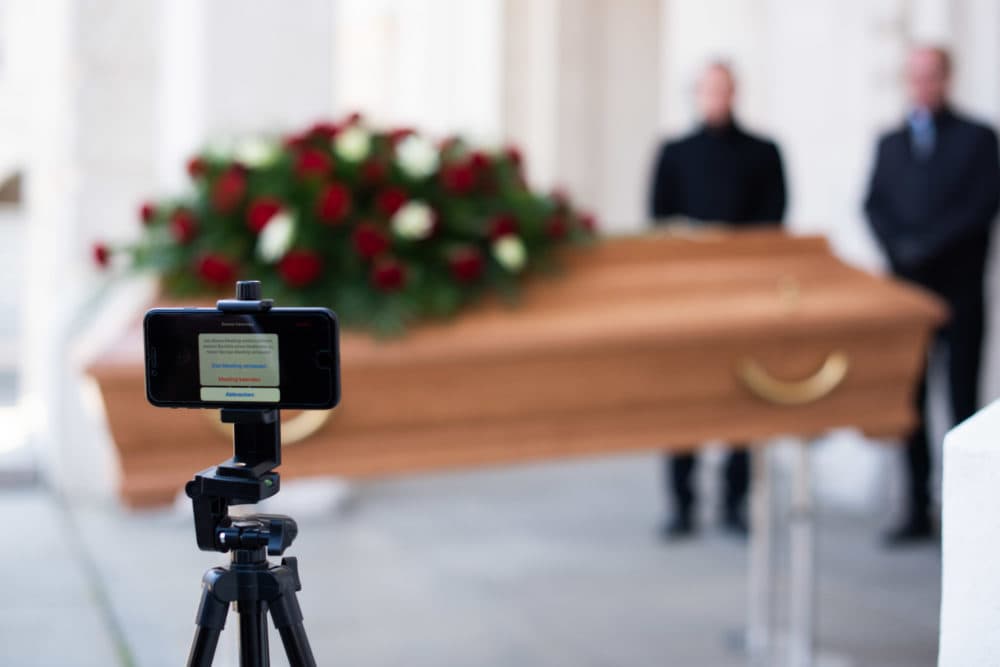 Undertakers rehearsing a live streamed funeral. (Thomas Kronsteiner/Getty Images)