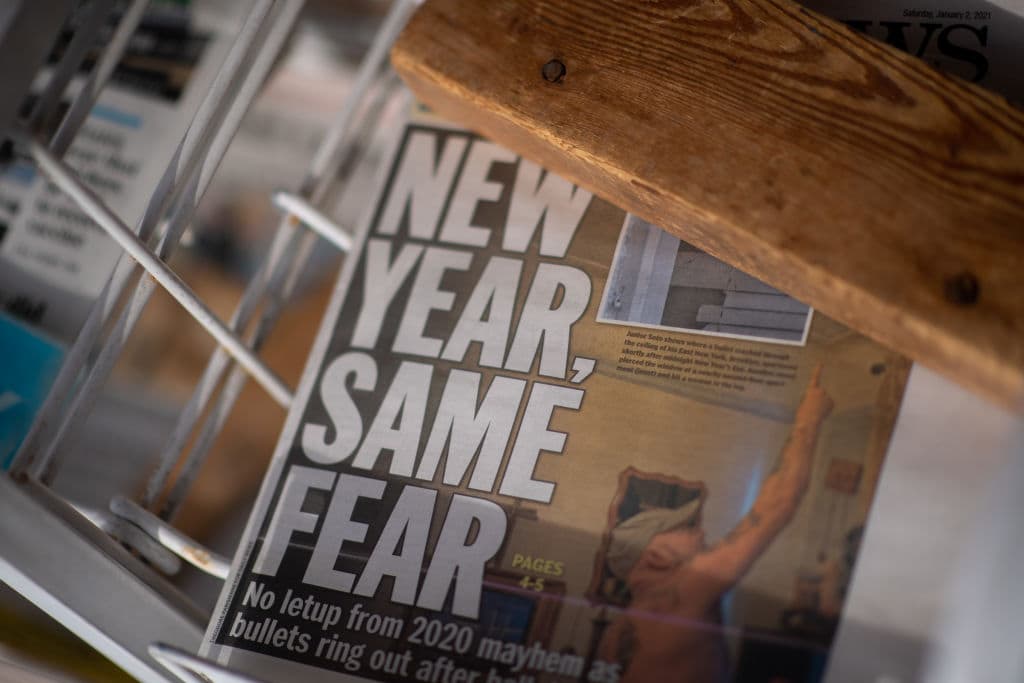 A newspaper with a headline stating "NEW YEAR, SAME FEAR" is displayed on Jan. 2, 2021 in Rehoboth Beach, Delaware. (Mark Makela/Getty Images)