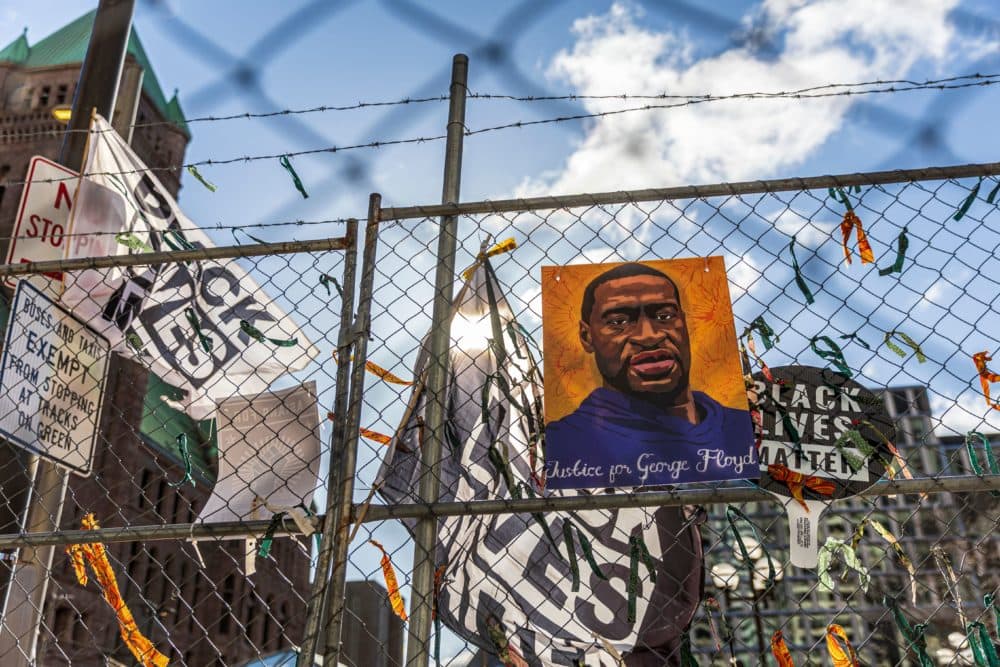 A poster with George Floyd's picture and a sign reads that &quot;I Can't Breathe&quot; hang from a security fence outside the Hennepin County Government Center on March 31, 2021 in Minneapolis, Minnesota. (Kerem Yucel/AFP via Getty Images)