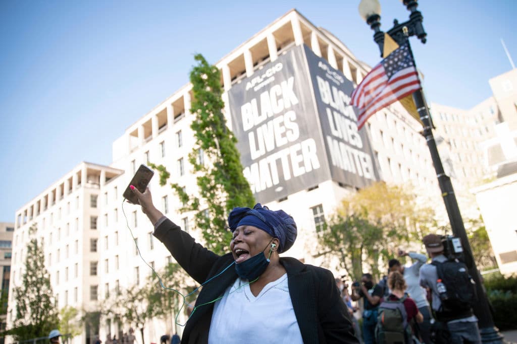 A person celebrates the verdict of the Derek Chauvin trial at Black Lives Matter Plaza near the White House on April 20, 2021 in Washington, D.C. (Sarah Silbiger/Getty Images)