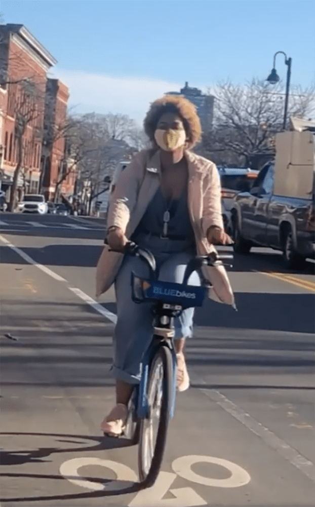 Keona Wynne rides a BlueBike in an Instagram video imploring people to get vaccinated (Screenshot Instagram)