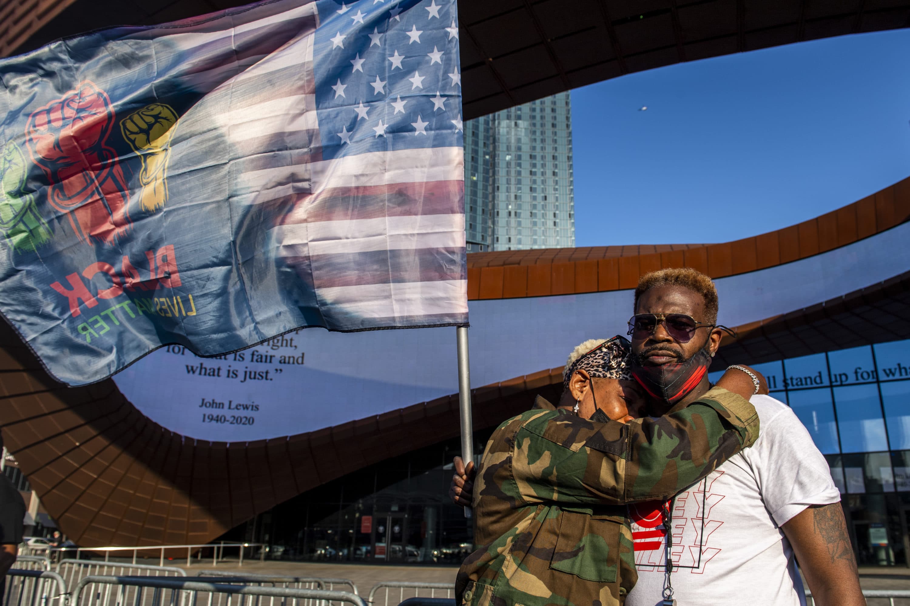 Ingrid Noel, 51, left, weeps on the shoulder of Robert Bolden, at a rally outside the Barclays Center on Tuesday in the Brooklyn borough of New York. (Brittainy Newman/AP)