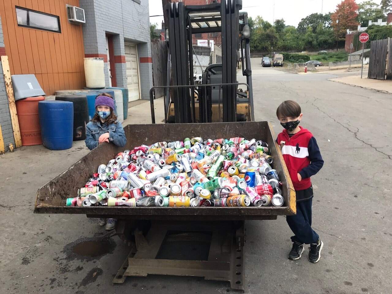 Teagan and Leo Ellsworth drop off their collection to Warhola Recycling. (Courtesy of Janeen Ellsworth.)