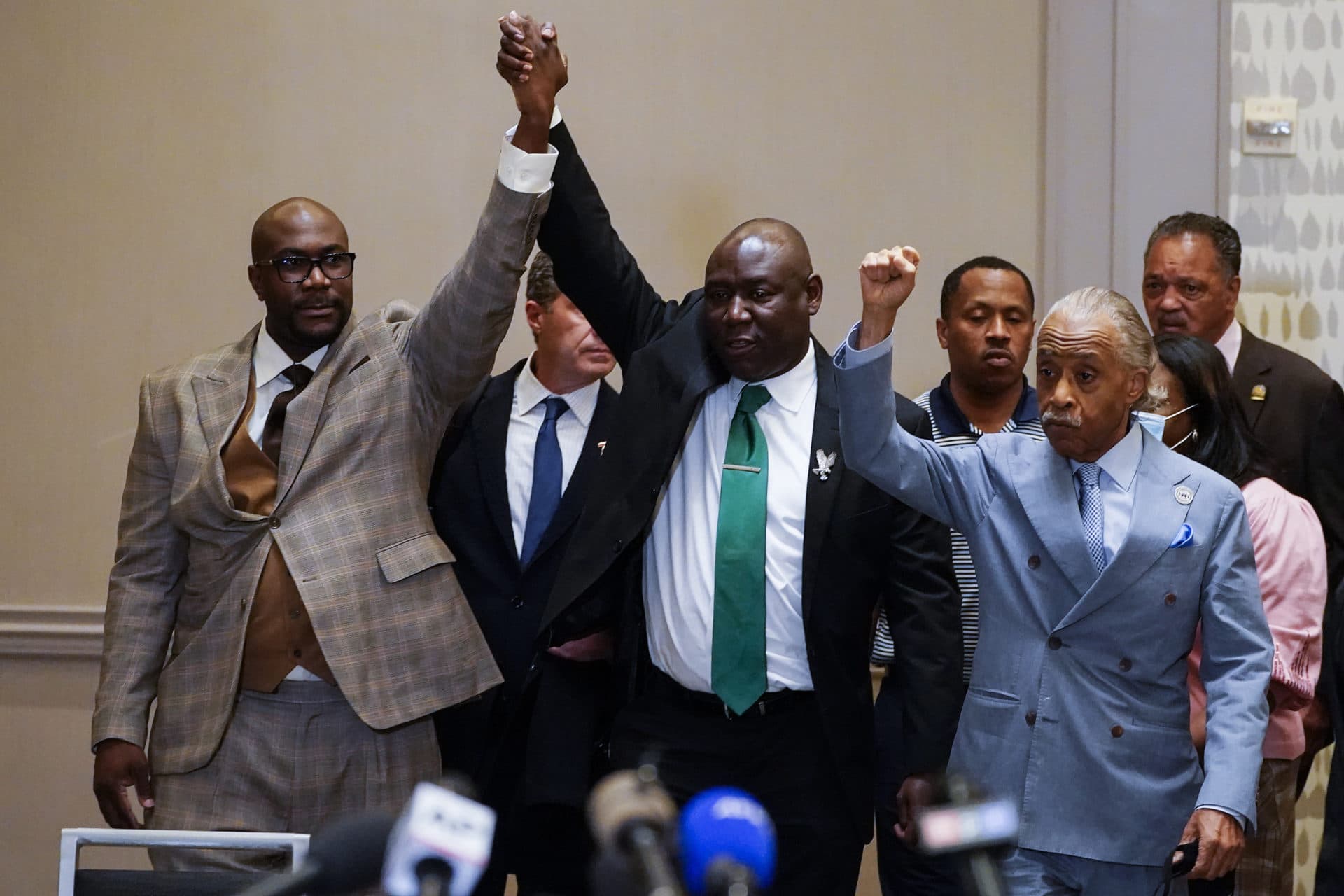 Philonise Floyd, Attorney Ben Crump and the Rev, Al Sharpton, from left, react after a guilty verdict was announced Tuesday at the trial of Derek Chauvin in Minneapolis, Minn. (Julio Cortez/AP)