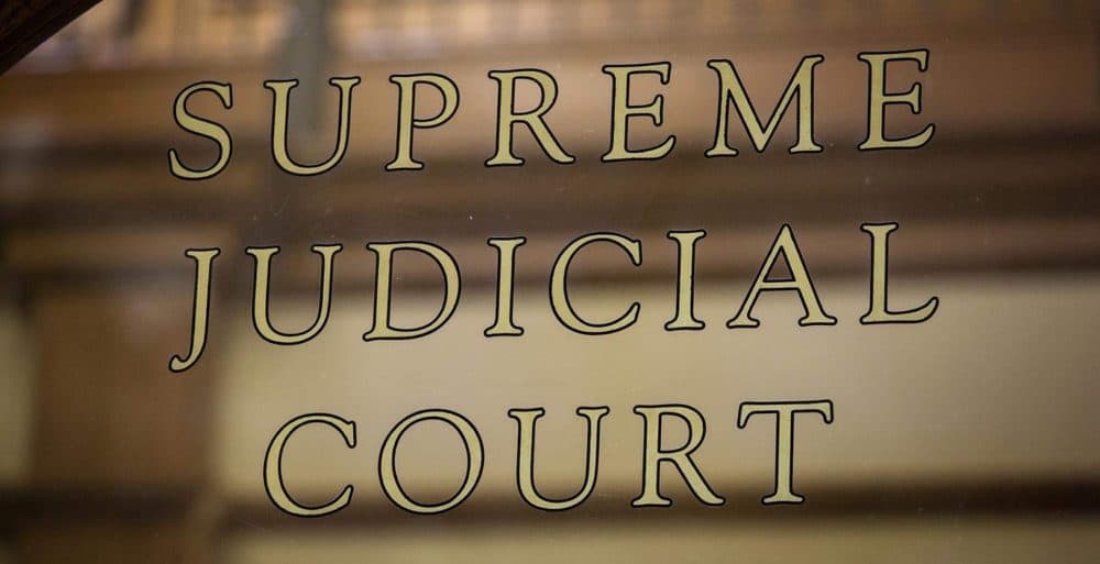 Supreme Judicial Court sign at the John Adams Courthouse in Boston. (Robin Lubbock/WBUR)
