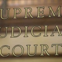 Supreme Judicial Court sign at the John Adams Courthouse in Boston. (Robin Lubbock/WBUR)