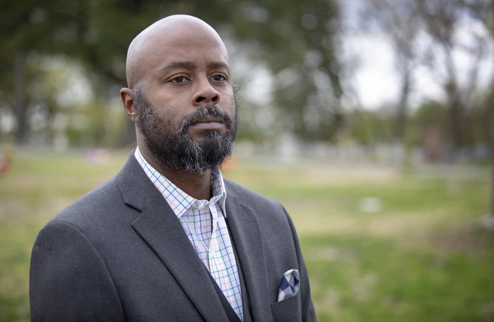 Victor Watson, owner of Bishop Funeral Home looks across Hope Cemetery in Worcester, Mass. (Robin Lubbock/WBUR)