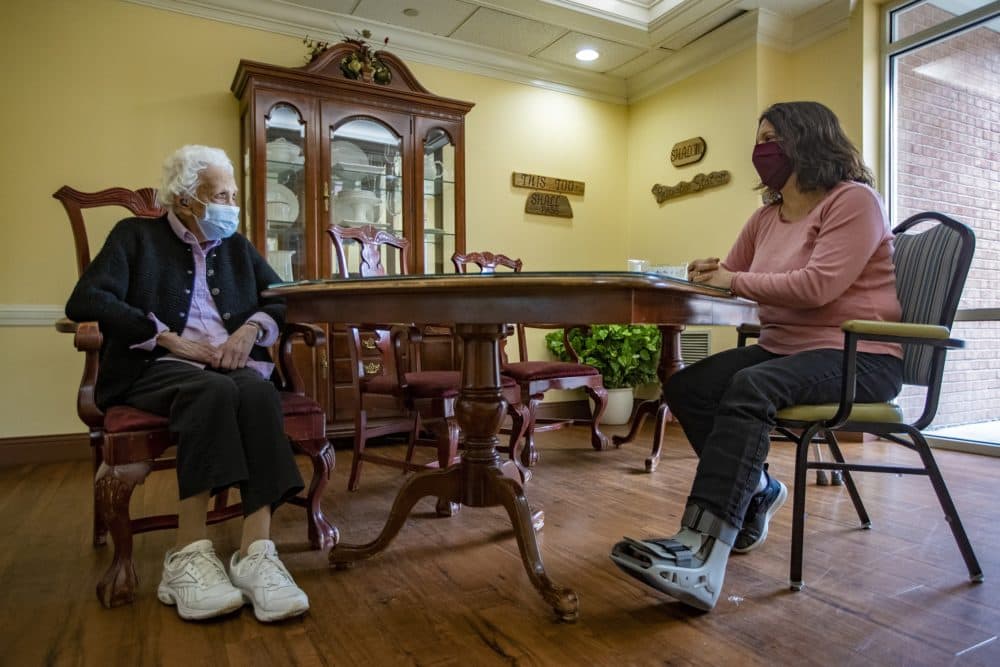 Anna Pollard, right, visits with her 101-year-old grandmother, Mary Smith at Life Care Center of West Bridgewater. (Jesse Costa/WBUR)