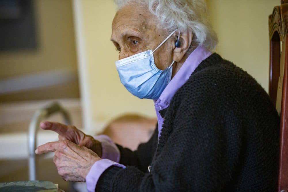 Mary Smith speaks with her granddaughter, Anna Pollard, during a visit at Life Care Center of West Bridgewater. (Jesse Costa/WBUR)