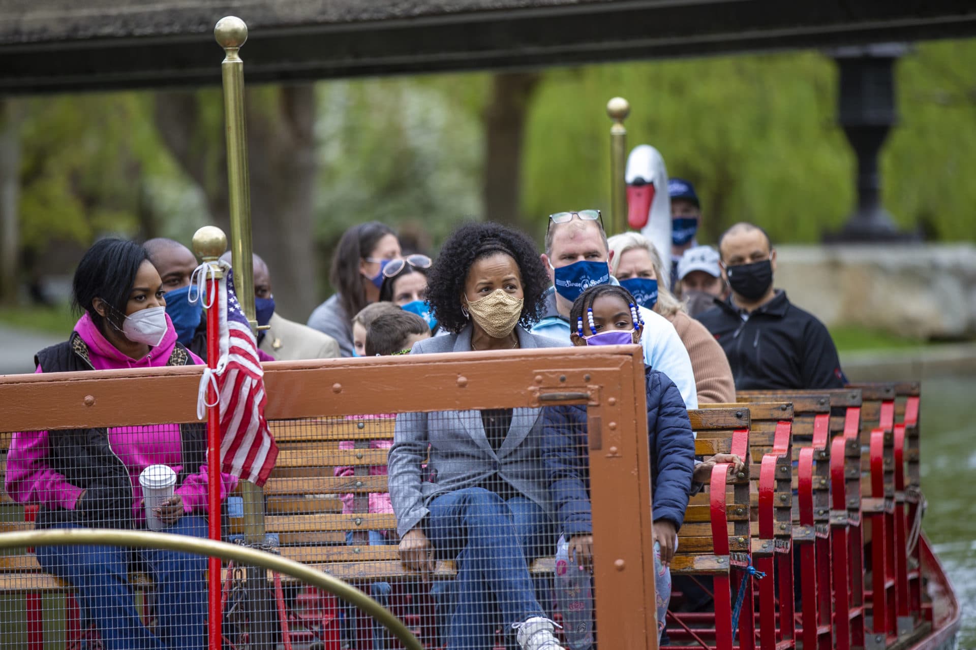 Boston Mayor Kim Janey takes the ceremonious first ride of the season on a swan boat in the Public Garden lagoon. (Jesse Costa/WBUR)