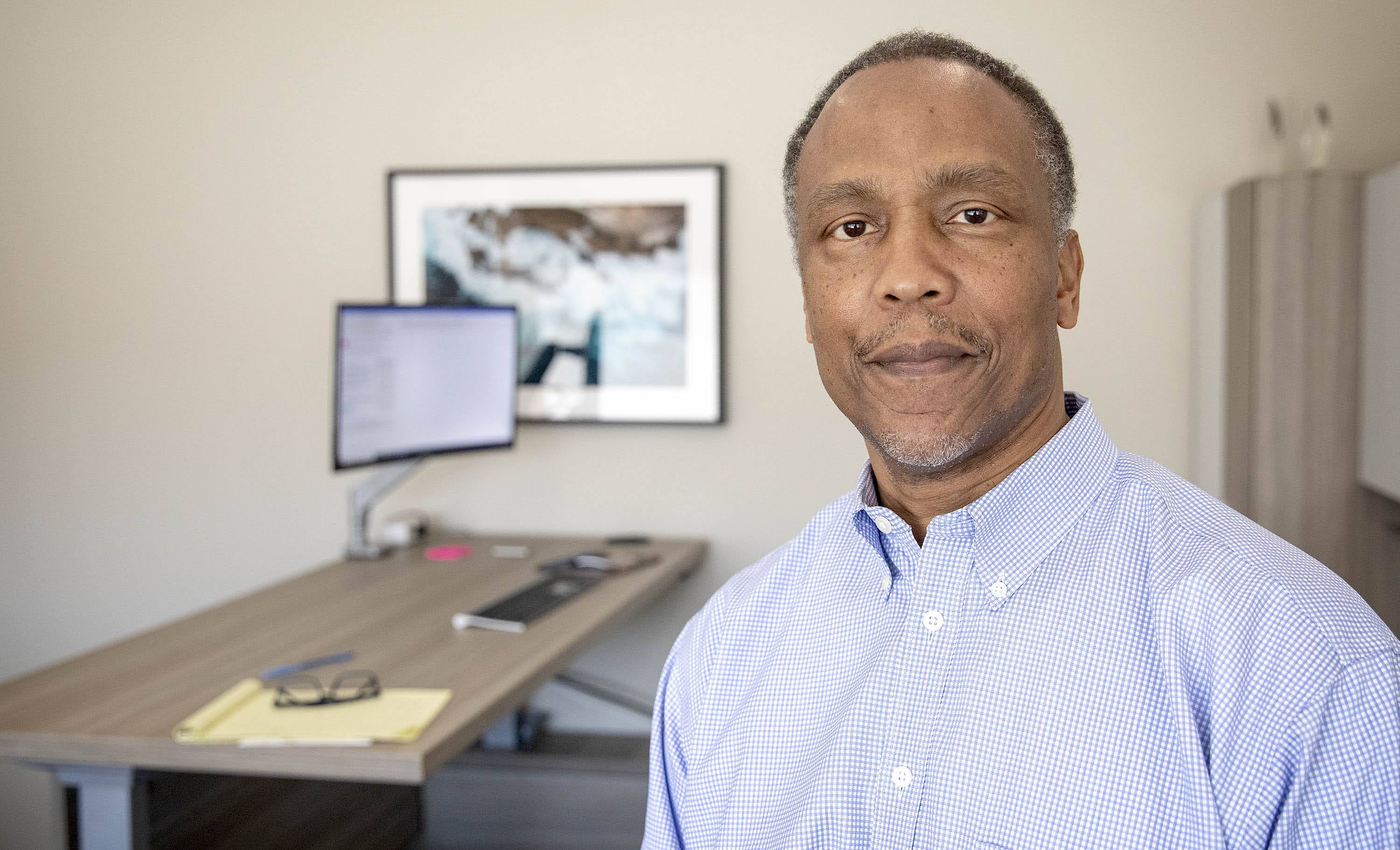 Anthony Samuels, CEO of DRB Facility Services, at his office in Copley Place, Boston. (Robin Lubbock/WBUR)