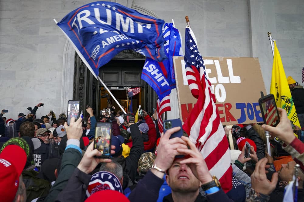 In this Jan. 6, 2021, file photo, Trump supporters gather outside the Capitol in Washington. (John Minchillo, File/AP)