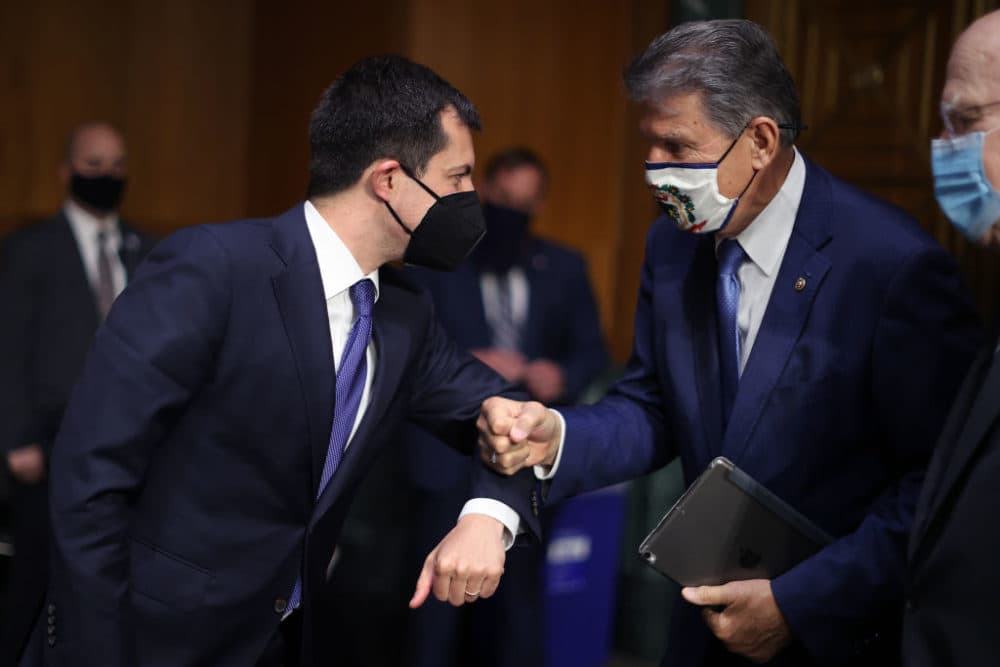 Transportation Secretary Pete Buttigieg (L) greets Sen. Joe Manchin (D-WV) after testifying before the Senate Appropriations Committee in the Dirksen Senate Office Building on Capitol Hill on April 20, 2021 in Washington, DC. (Chip Somodevilla/Getty Images)