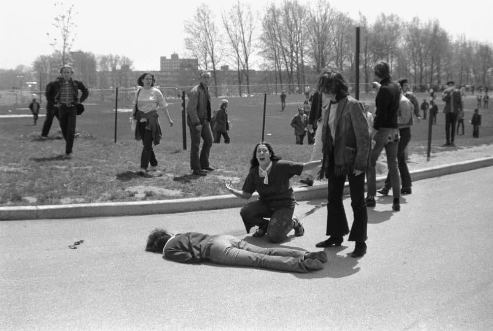 Teenager Mary Ann Vecchio screams as she kneels over the body of Kent State University student Jeffrey Miller (1950 - 1970) who had been shot during an anti-war demonstration on the university campus, Kent, Ohio, May 4, 1970. A cropped version of this image won the Pulitzer Prize. (John Filo/Getty Images)