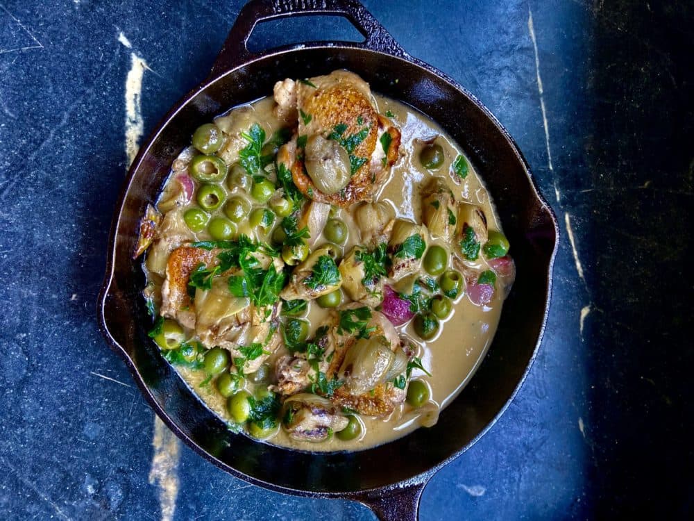Braised chicken thighs with artichokes, green olives and shallots (Kathy Gunst)
