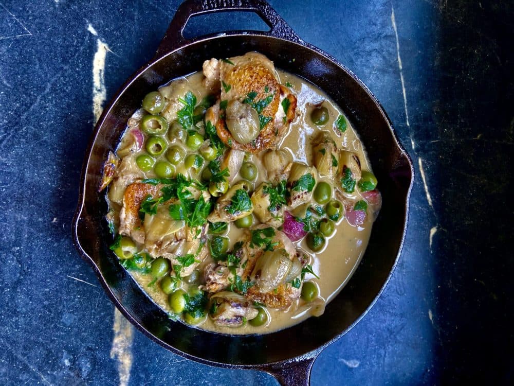 Braised chicken thighs with artichokes, green olives and shallots (Kathy Gunst)