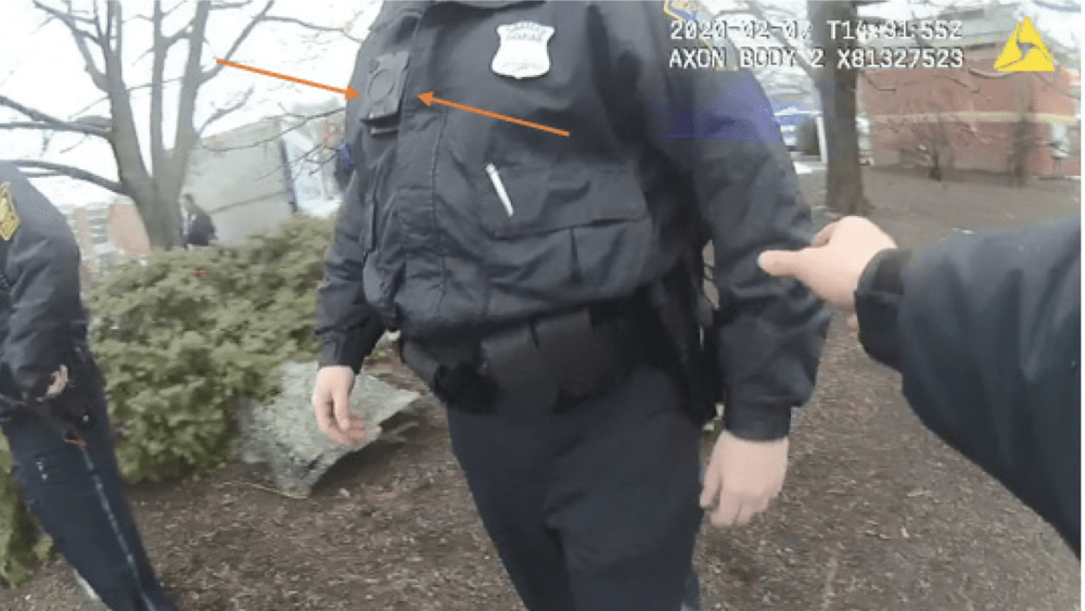 A video still from a Boston police officer's body camera shows Officer David Godin with his body camera attached to his uniform, a new legal filing says. Godin told investigators that he wasn't wearing his camera during the shootings of Juston Root. (Boston federal court)