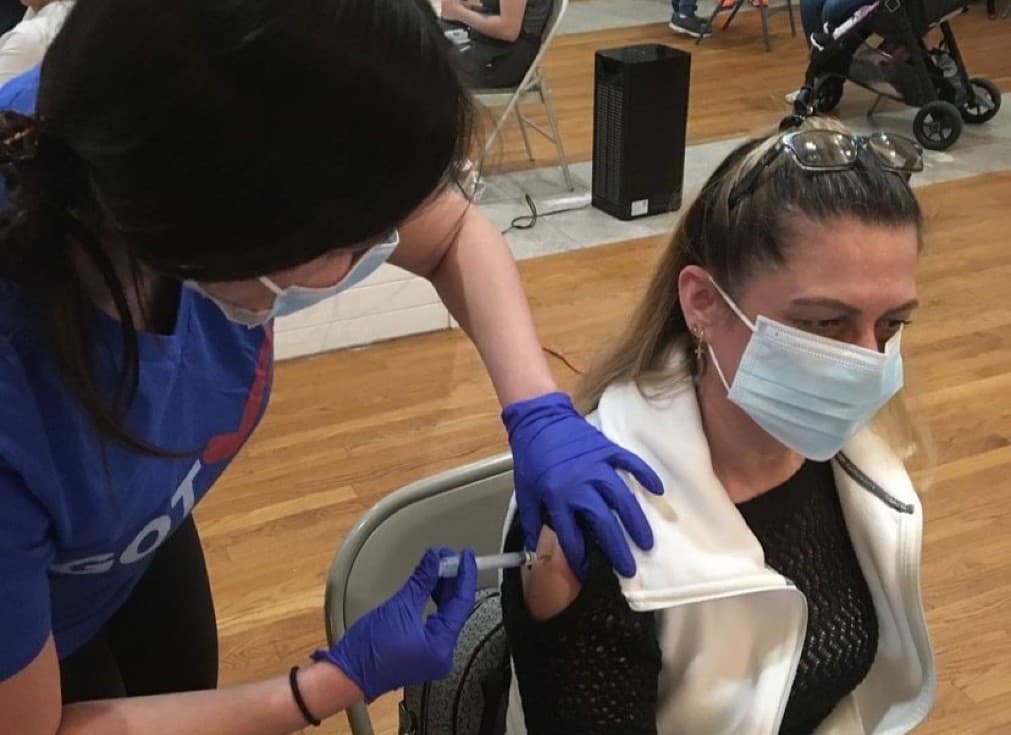 A woman is vaccinated in East Boston as part of the GOTVax campaign. (Courtesy)