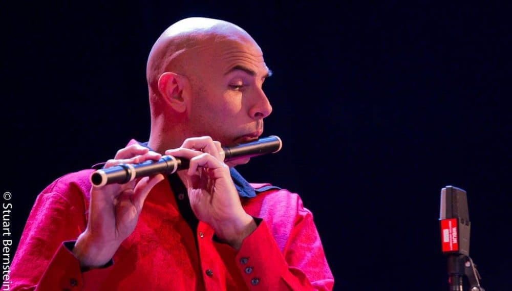 Eric Shimelonis playing the baroque flute at Circle Round’s live performance at the Boston Jewish Film Festival. (courtesy of Stuart Bernstein)