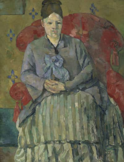 Cézanne painted his wife with an inscrutable expression in &quot;Madame Cézanne in a Red Armchair&quot; (1877). (Courtesy Museum of Fine Arts, Boston)