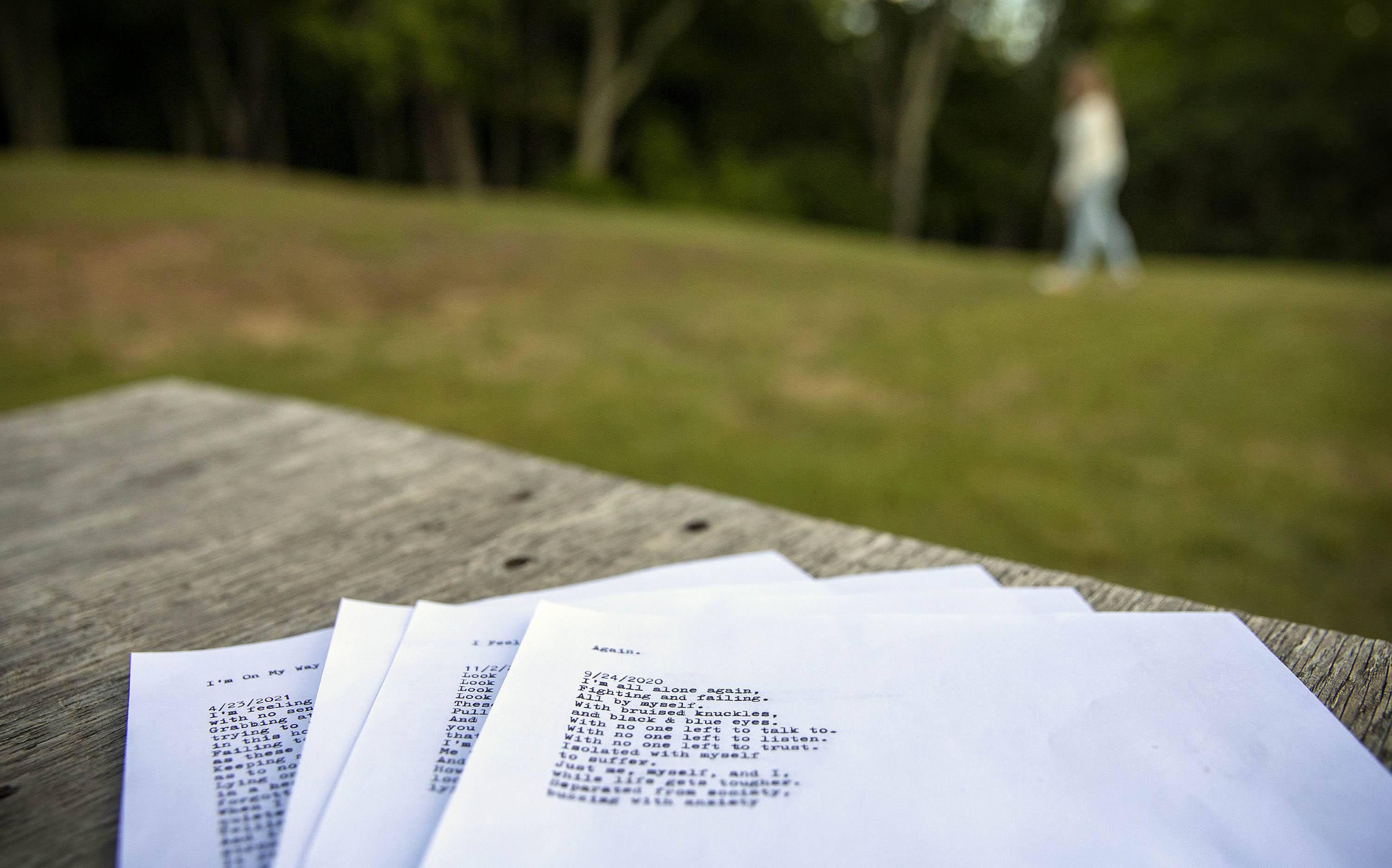 Marie writes poetry to help process her emotions. The first line of one poem reads, "I'm all alone again." (Robin Lubbock/WBUR)