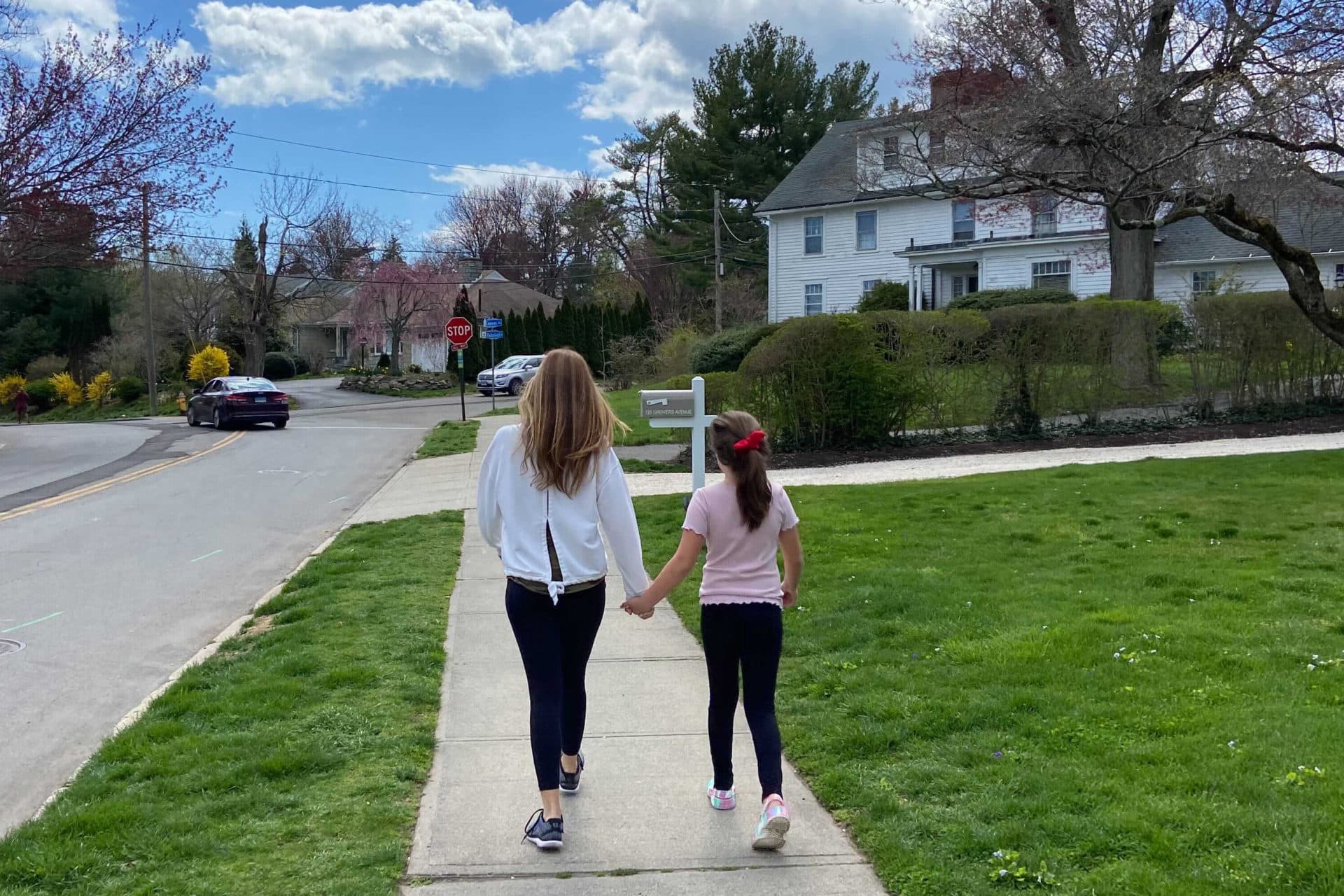 Ana Groves, left, walking with her daughter down a street. (Courtesy Ana Groves)