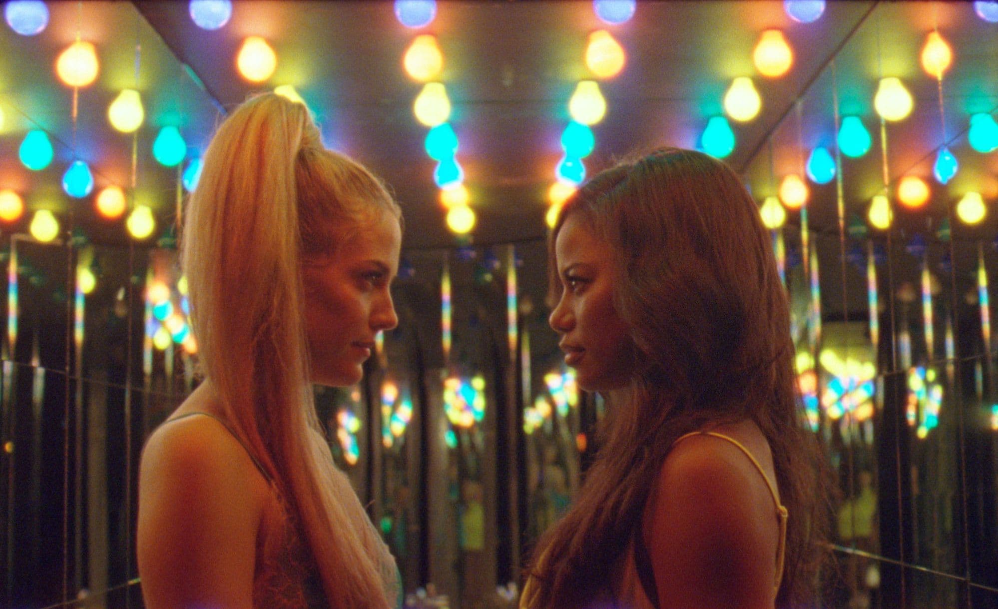 Taylour Paige (right) as Zola and Riley Keough as Stefani in &quot;Zola.&quot; (Courtesy A24)