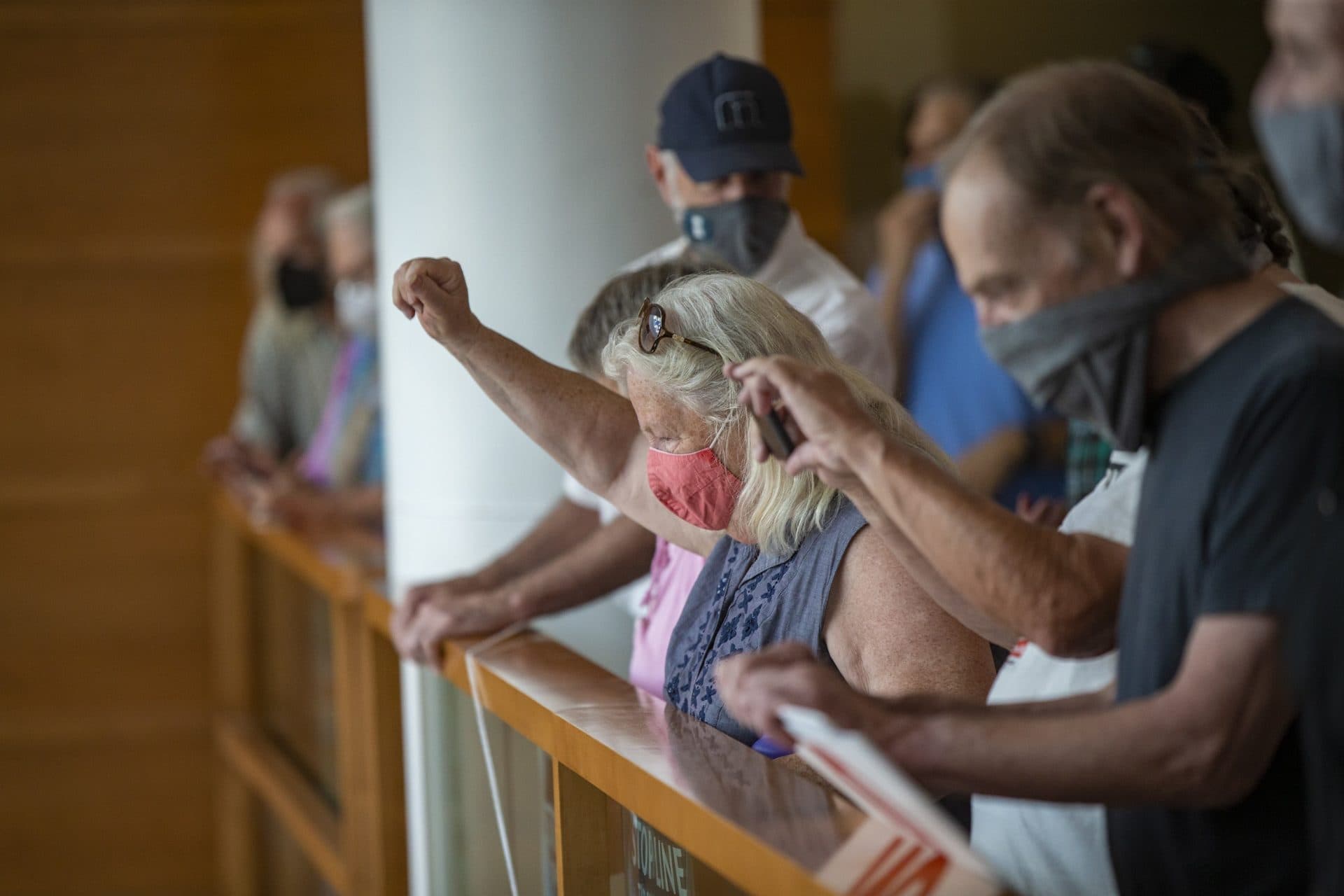 Protesters in the lobby of the Enbridge office. (Jesse Costa/WBUR)