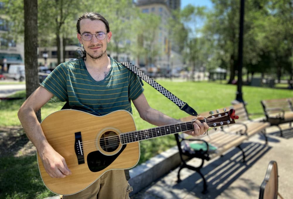 Andy Cavanaugh of Middleborough came to Boston Common Tuesday to try to earn money playing guitar. (Quincy Walters/WBUR)