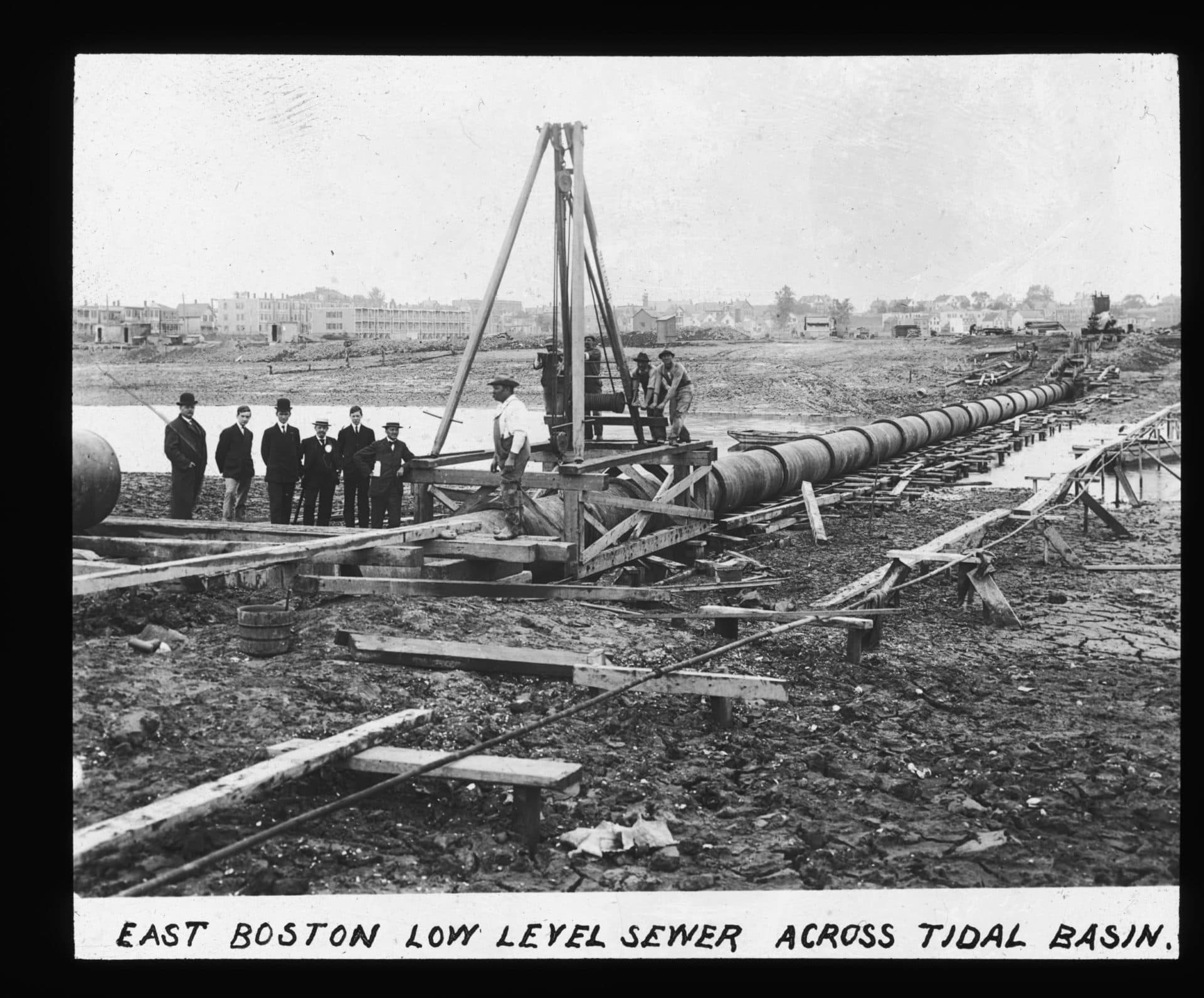 Workers level a sewer pipe in East Boston (Courtesy Boston Water and Sewer Commission)
