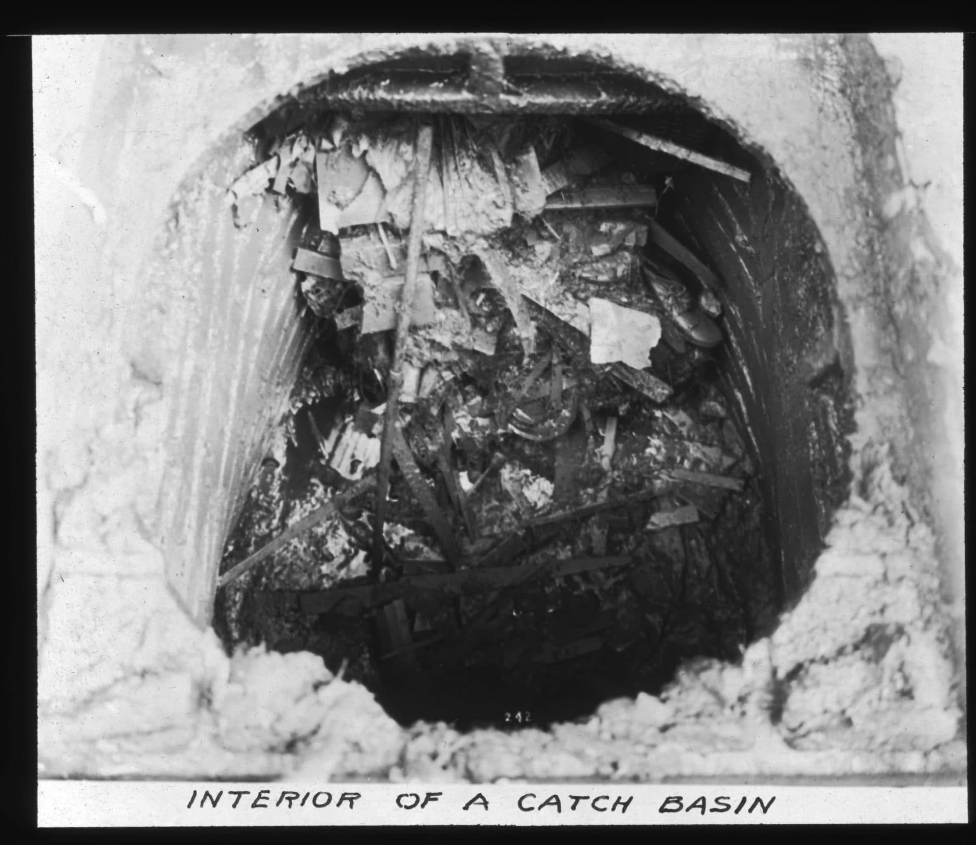 Even though dumping trash in the sewer was prohibited, people did it anyway, as this photo from the 1880s shows (Courtesy Workers level a sewer pipe in East Boston (Courtesy Boston Water and Sewer Commission)