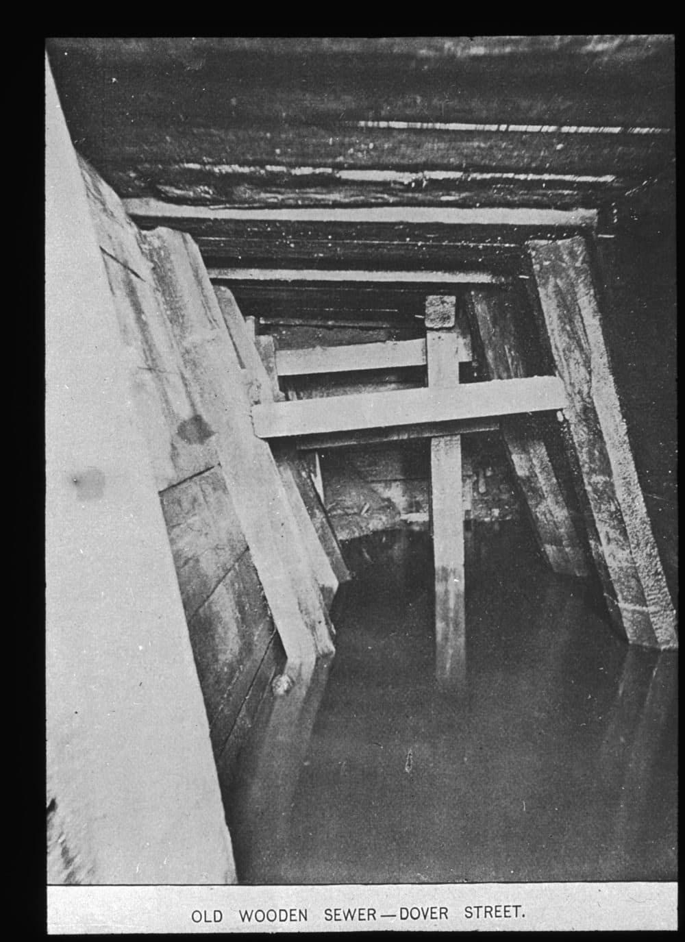 This wooden sewer line was considered old when this photo was taken during the 1880s (Courtesy Boston Public Library)
