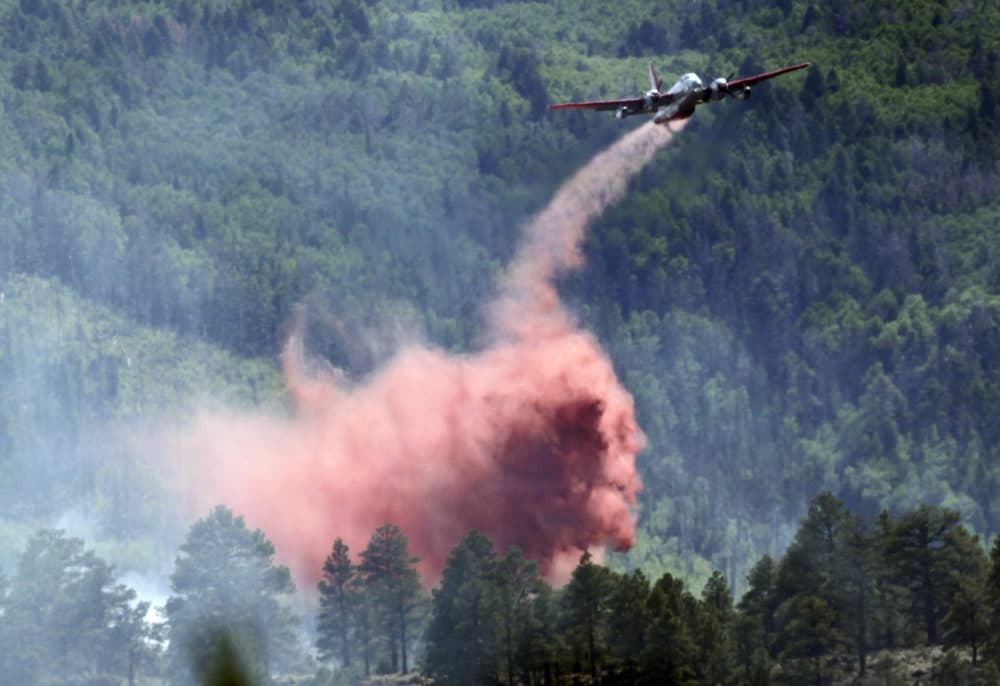 From June 2010: A plane drops fire retardant on the Schultz Fire in Flagstaff, Ariz. (Matt York/AP)