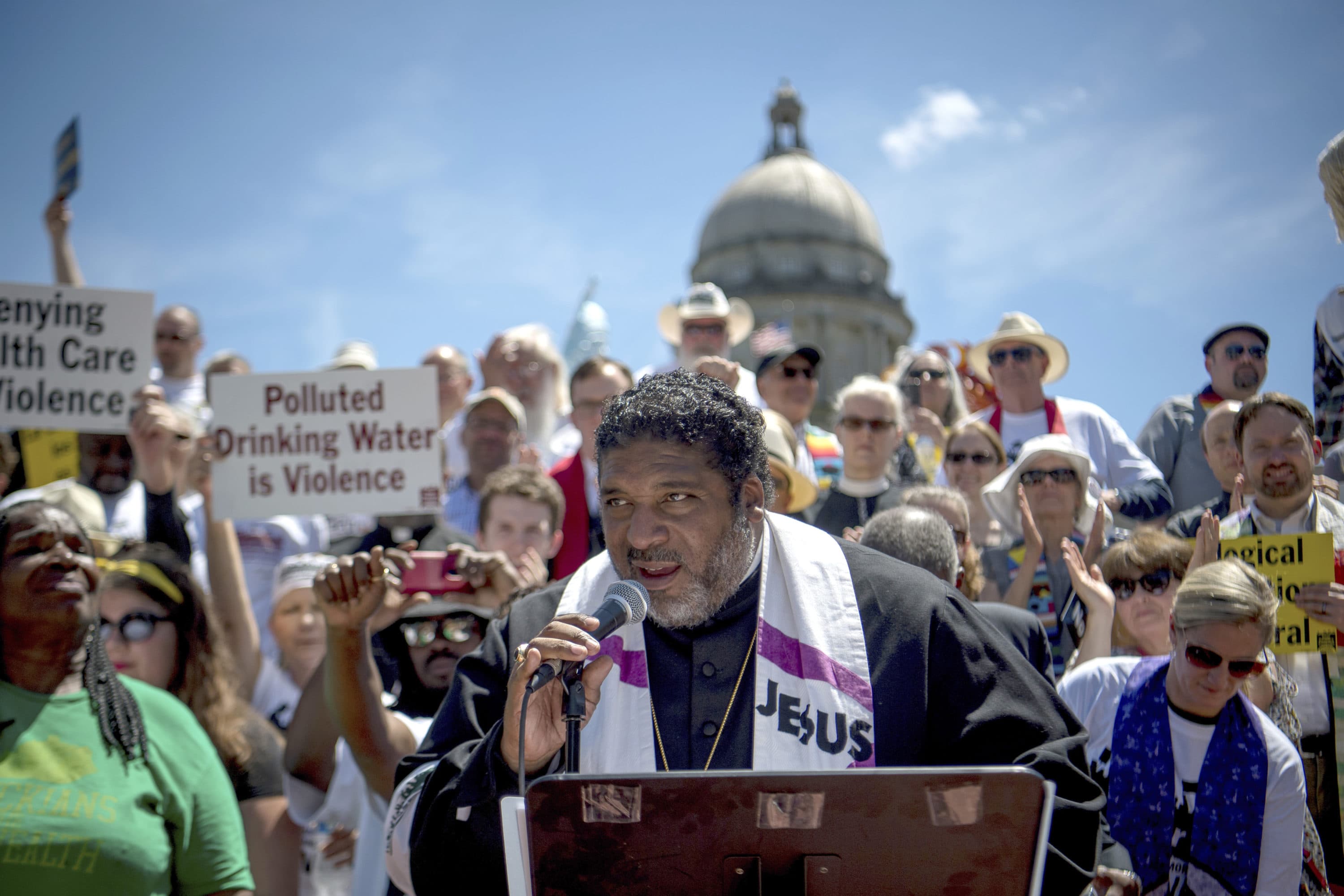 Reverend William J. Barber speaks to protesters gathered during a protest organized by Kentucky Poor People's Campaign in Frankfort, Ky., in 2018. (Bryan Woolston/AP)