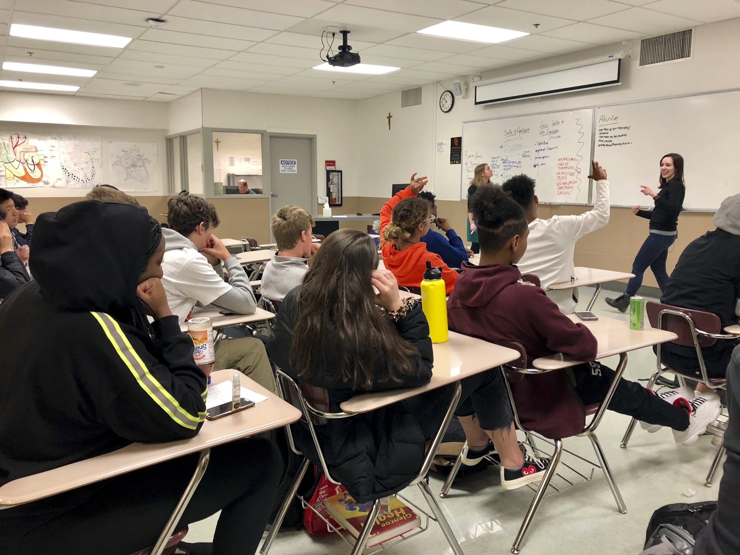 Instructors lead a classroom discussion about consent and healthy relationships with a class of sophomores at Central Catholic High School in Portland, Ore., in 2019. (Gillian Flaccus/AP)