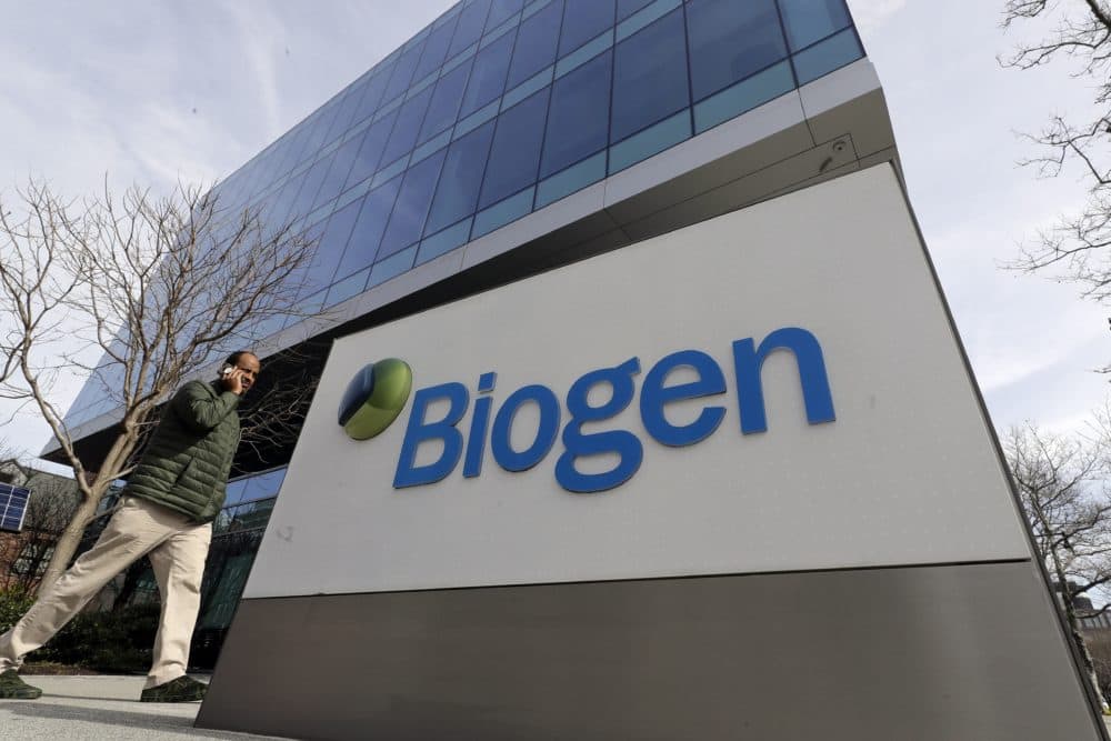 A man walks past the Biogen Inc. headquarters in Cambridge, Mass. (Steven Senne/AP)