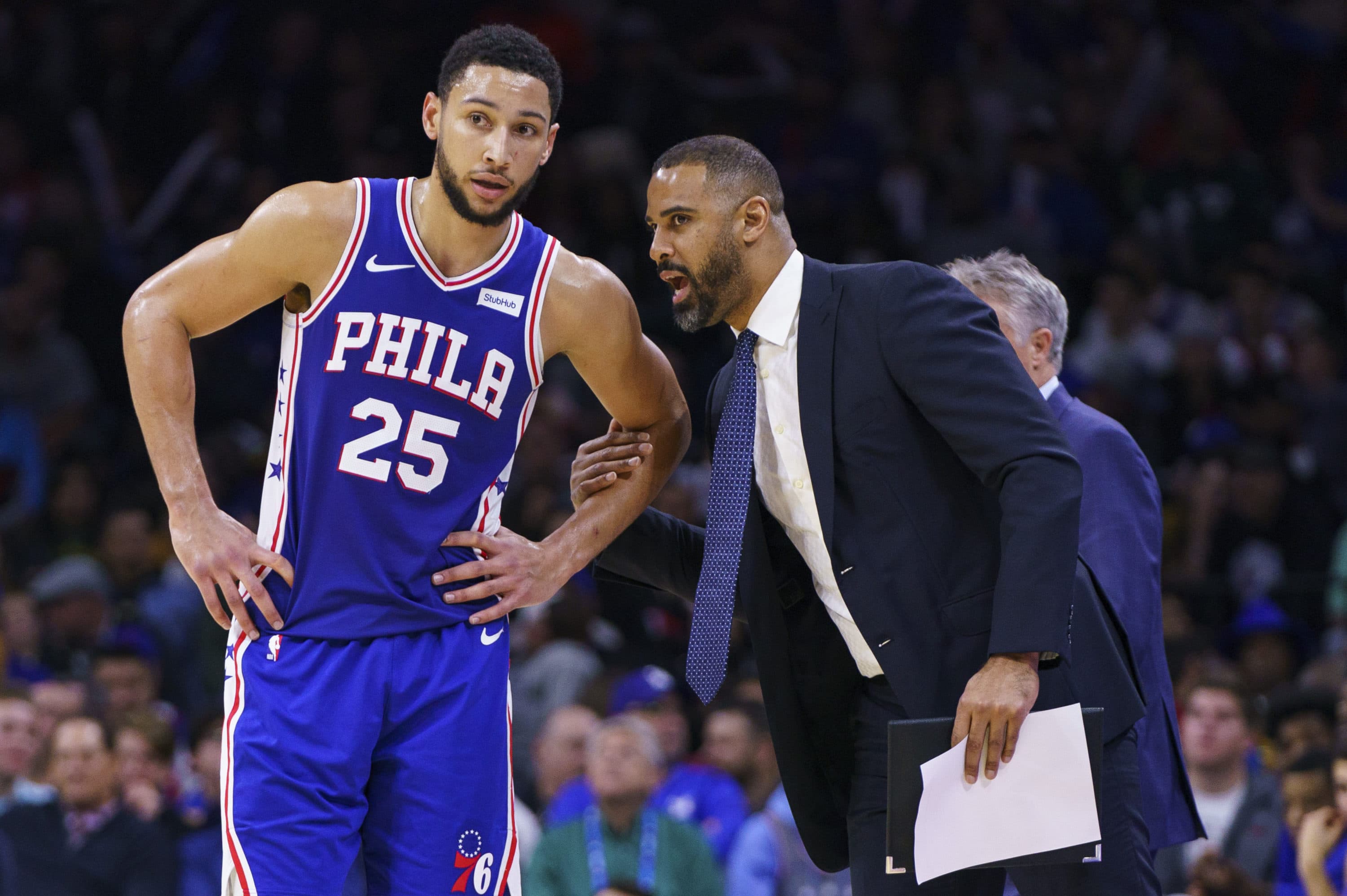 Philadelphia 76ers' Ben Simmons, left, listens to assistant coach Ime Udoka, right, during the second half of an NBA basketball game against the Sacramento Kings in Philadelphia. (Chris Szagola/AP)