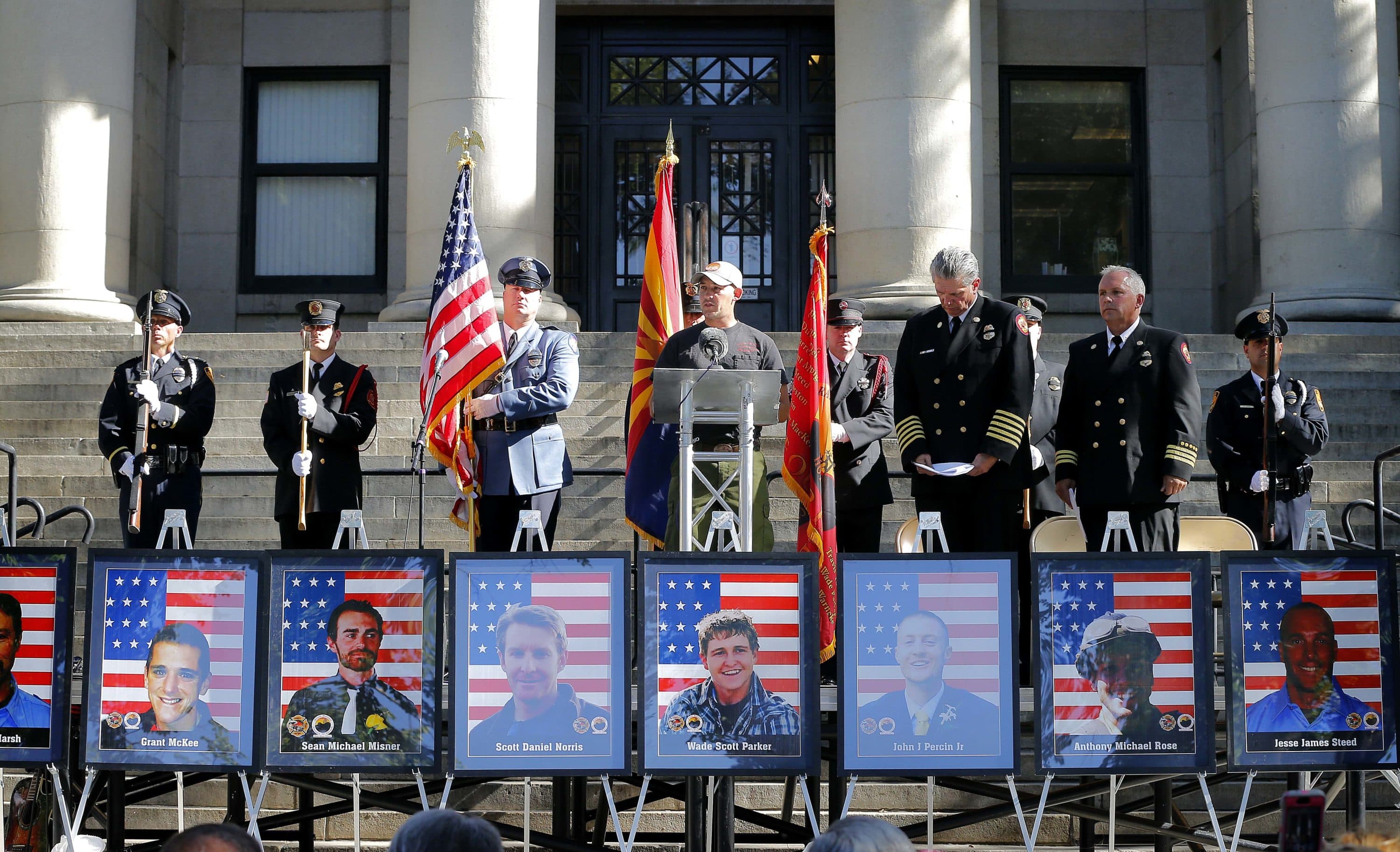 Former Granite Mountain Hotshot Patrick McCarty read the names of the 19 Granite Mountain Hotshots who died in the wildfire. (Matt York/AP)