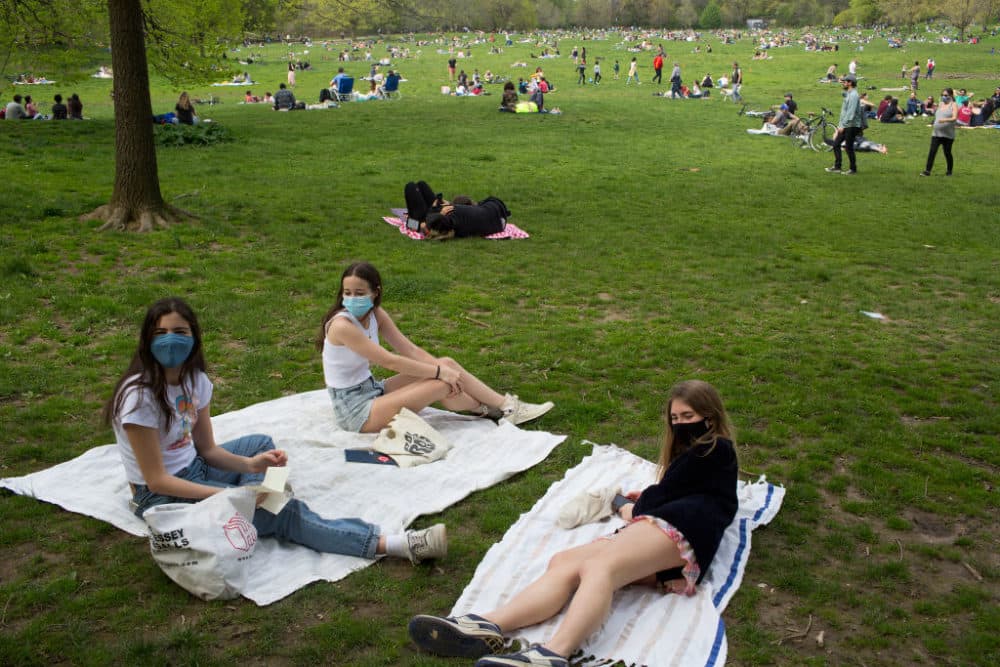 Three high school friends meet for the first time since school was cancelled six weeks ago on May 2, 2020 in Prospect Park in Brooklyn, New York. (Andrew Lichtenstein/Corbis via Getty Images)