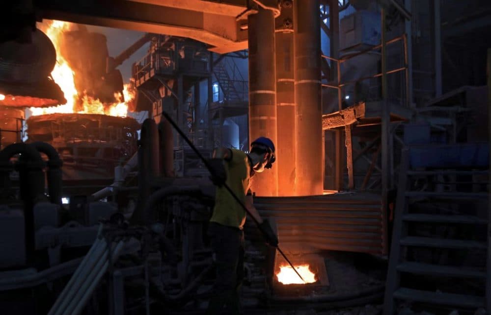 A worker operates a furnace for steelmaking at Hend steel company in Arbil, the capital of the northern Iraqi Kurdish autonomous region, in 2020. (Safin Hamed/AFP/Getty Images)