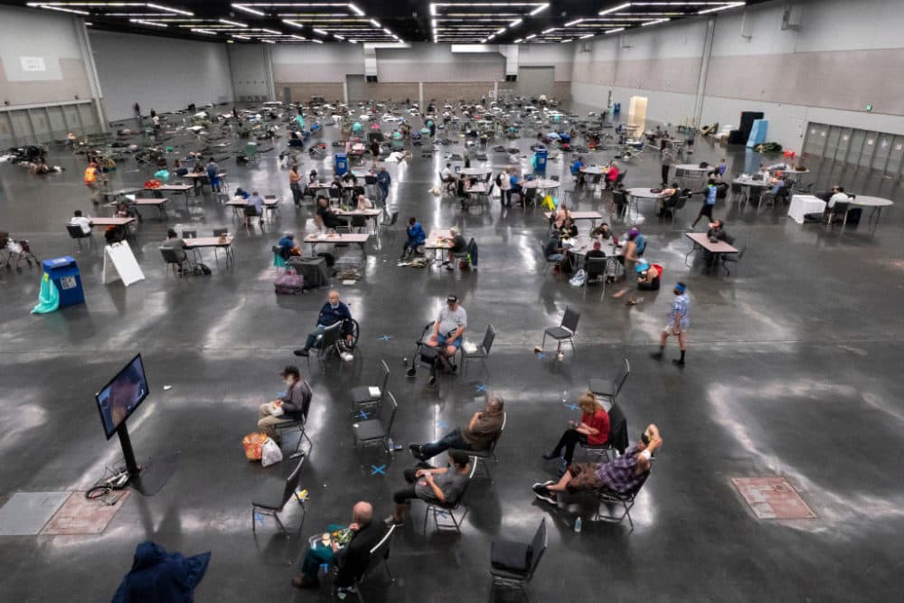 Portland residents fill a cooling center with a capacity of about 300 people at the Oregon Convention Center June 27, 2021 in Portland, Oregon. Record breaking temperatures lingered over the Northwest during a historic heatwave over the weekend. (Nathan Howard/Getty Images)