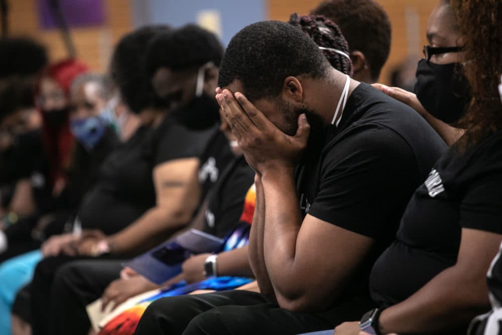 Family members mourn the death of Conrad Coleman Jr. following his funeral service on July 03, 2020 in New Rochelle, New York. Coleman, 39, died of COVID-19 on June 20, 2020, just over two months after his father Conrad Coleman Sr. also died of the disease. (John Moore/Getty Images)
