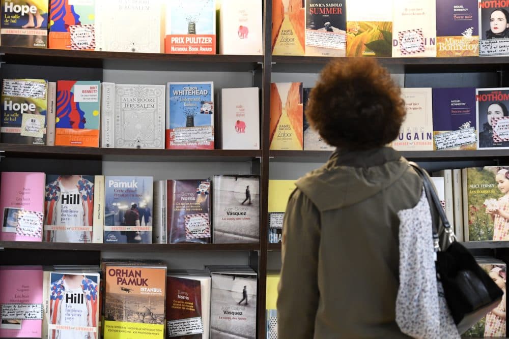 A visitor looks at books in a book shop. (Damien Meyer/AFP via Getty Images)