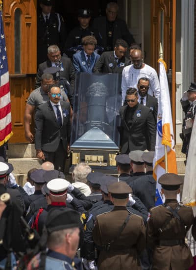 WORCESTER - Pall bearers carry the casket of fallen Worcester Police Officer Enmanuel Familia after his funeral Mass in St. John Church in Worcester, Massachusetts Thursday, June 10, 2021. (RICK CINCLAIR/TELEGRAM & GAZETTE)