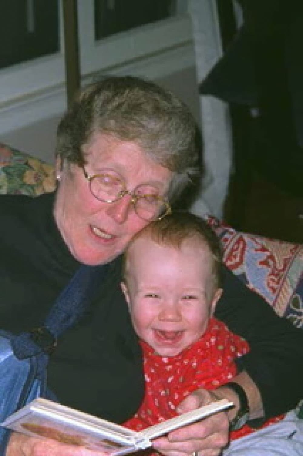 The author's mother reading to her grandson. (Courtesy)