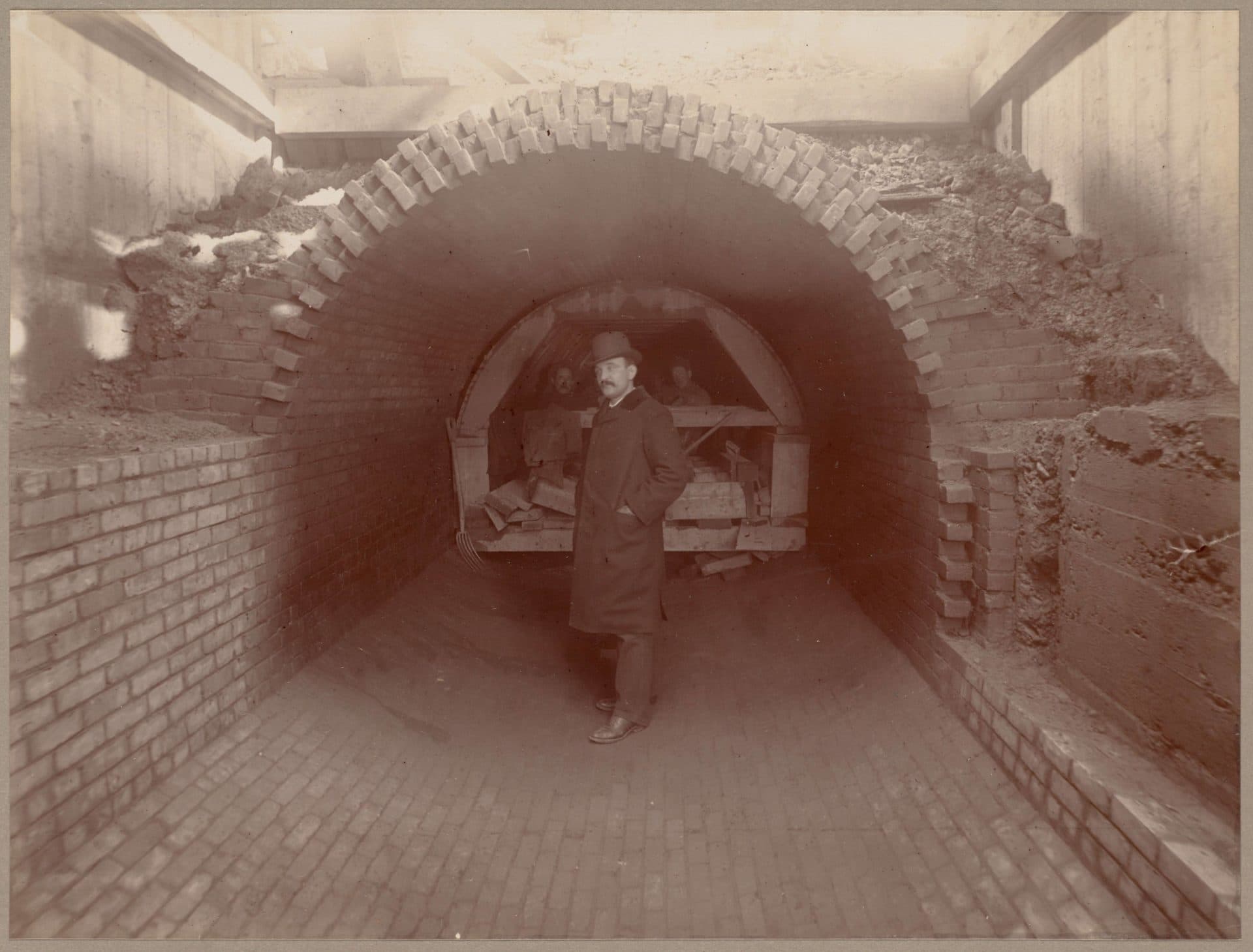 A man stands in front of a work crew during construction of a sewer line in the 1880s (Courtesy Boston Public Library)