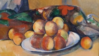 A detail of “Plate of Peaches” (1895-1900) by Cézanne. (Lloyd Schwartz/WBUR)