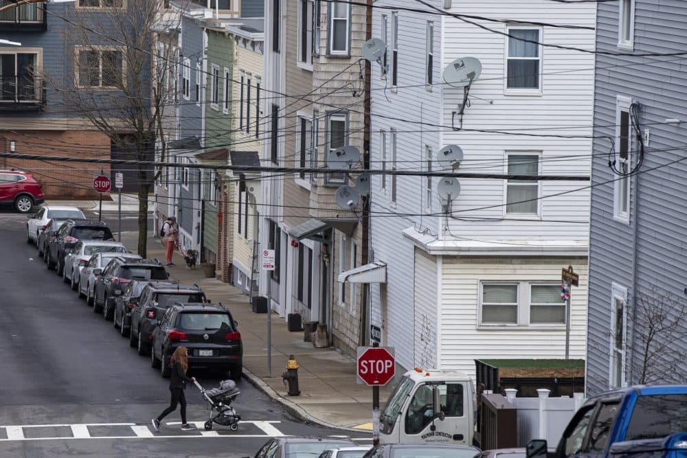 Triple and double decker apartment houses along Lamson Street in East Boston, March 2020. (Jesse Costa/WBUR)